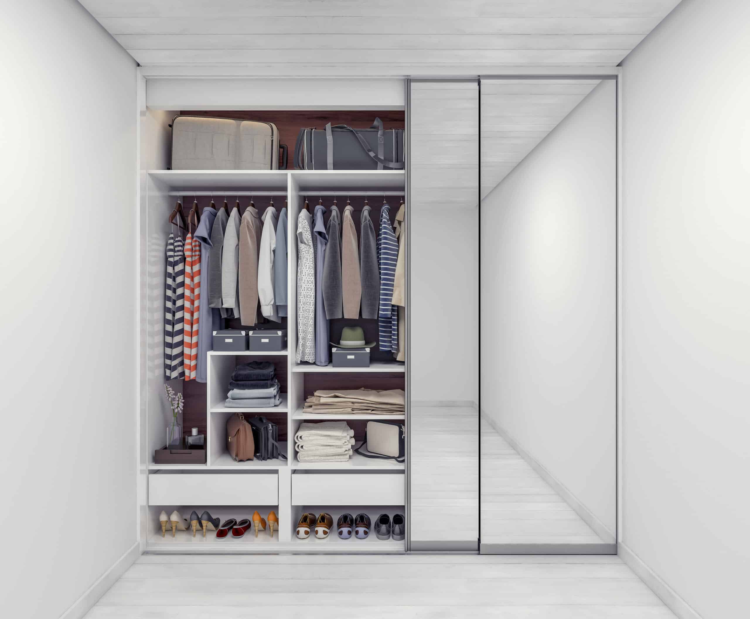 Shelves in a closet where you can store luggage plus clothes.