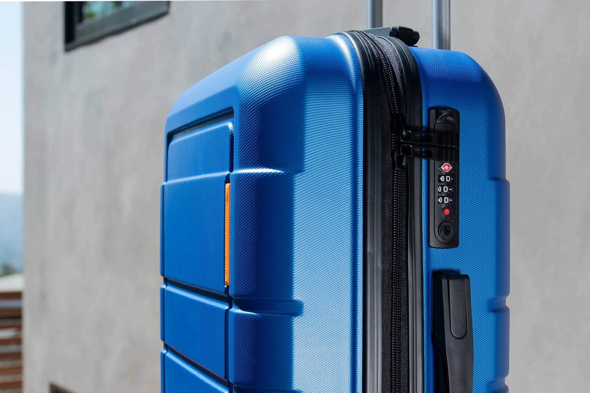 blue luggage with a TSA lock