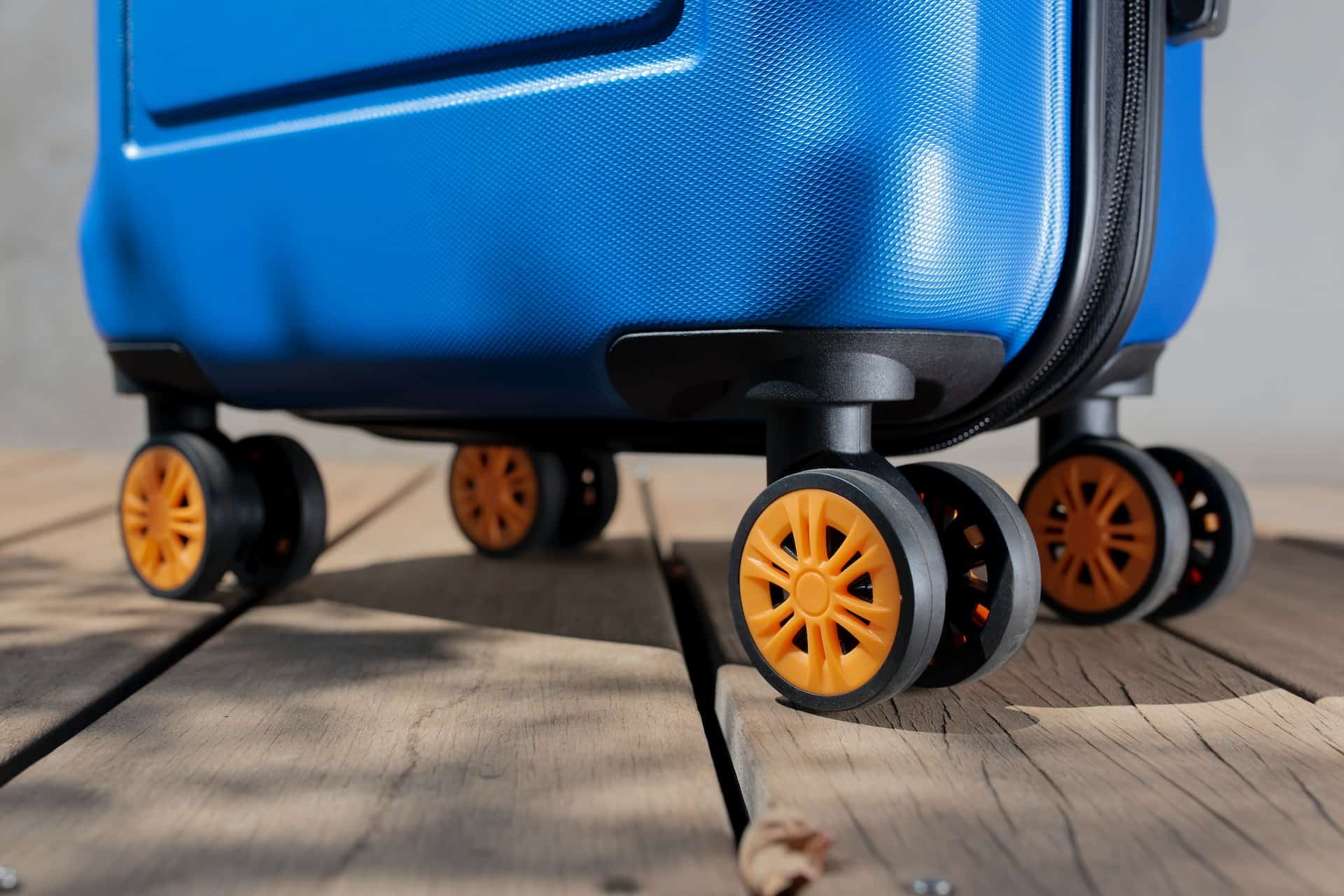 Can a 24-inch luggage be a carry-on? Wheels of a cabin suitcase orange wheels.
